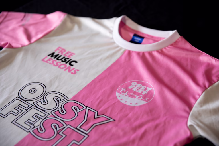 OSSYFEST Football Shirt, front of shirt featuring Free Music Lessons and Ossyfest logos.